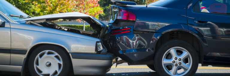 One car rear ending another car.